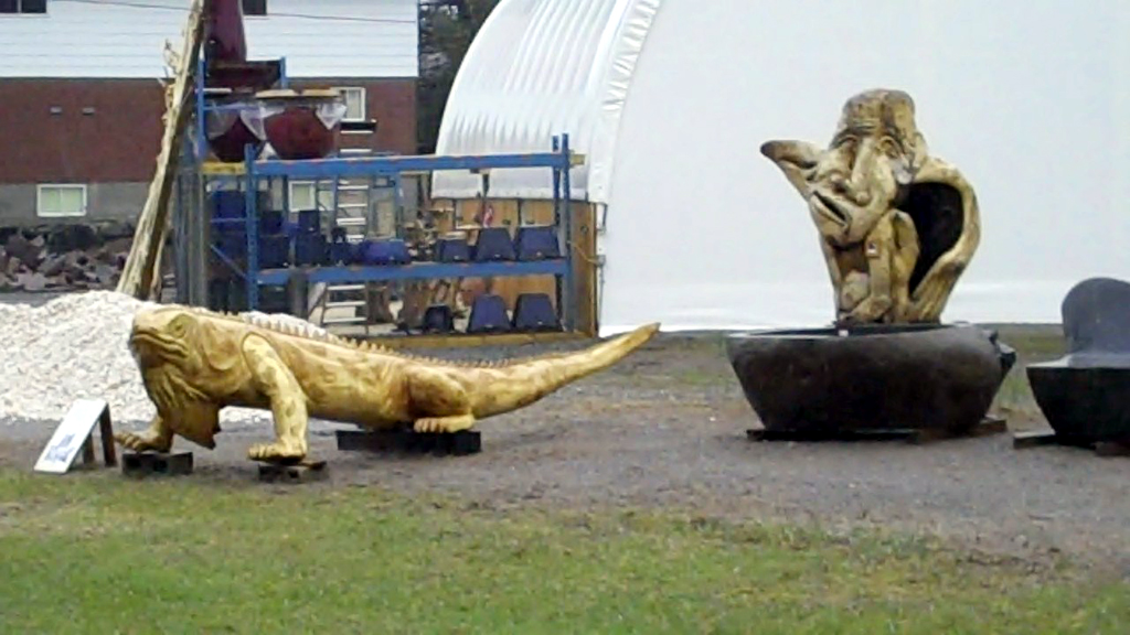 Lizard and Face Sculptures